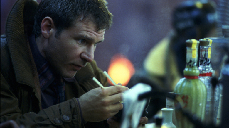 Deckard eating a meal in Blade Runner