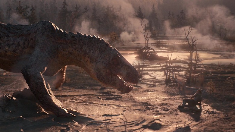 A dinosaur getting ready to attack Adam Driver as Mills in 65