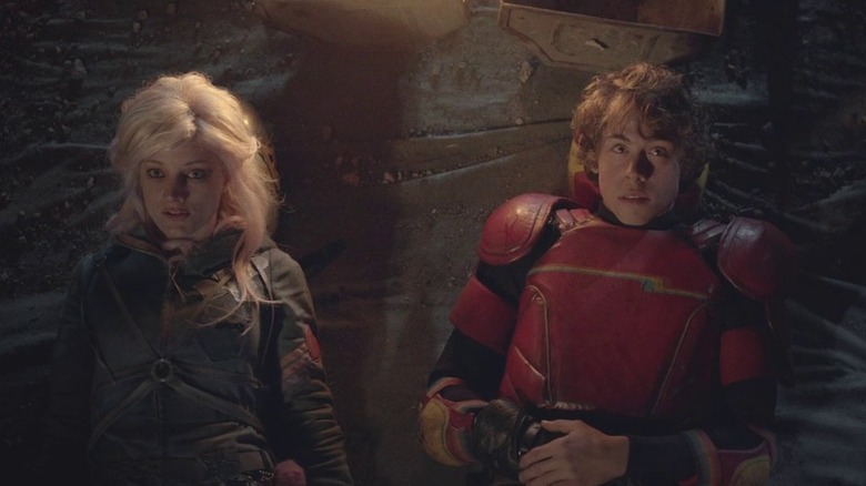 Laurence Leboeuf as Apple lying next to Munro Chambers as The Kid in Tubo Kid