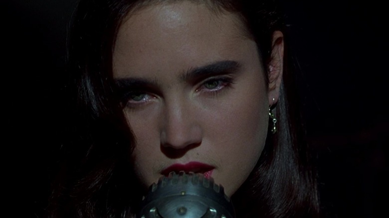 Jennifer Connelly's Emma Murdoch/Anna is seen in closeup in a dark room in Dark City