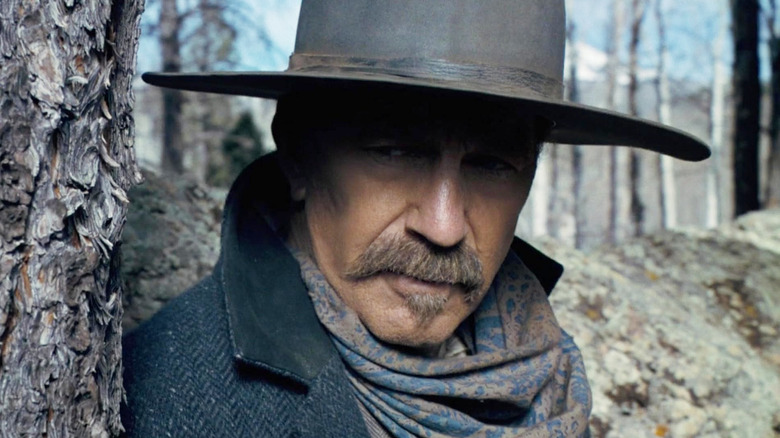 Hayes Ellison looking around the side of a tree in Horizon: An American Saga