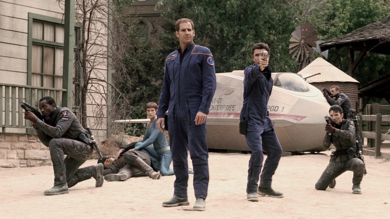Captain Archer, T'Pol, and Malcolm Reed srrounded by armed MACO warriors on Star Trek: Enterprise