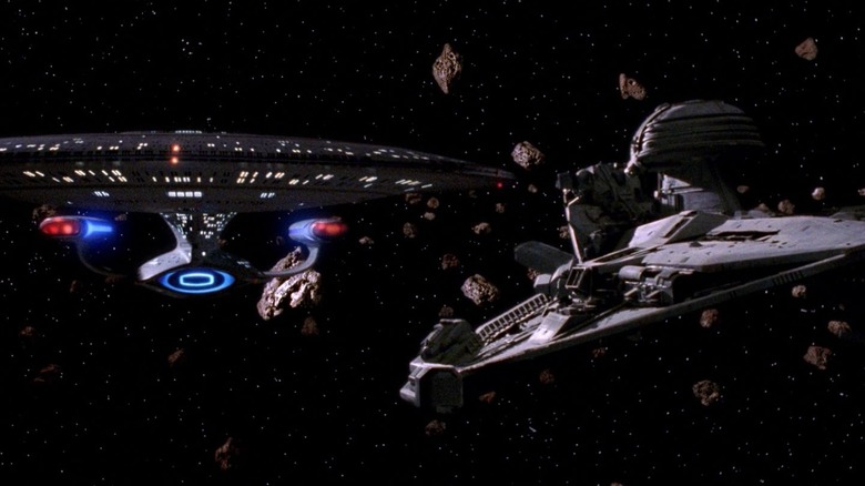The USS Enterprise-D next to a Promellian battle cruiser on Star Trek: The Next Generation