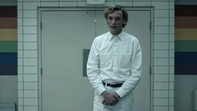 Jamie Campbell Bower's Henry Creel wearling an orderly's uniform on Stranger Things