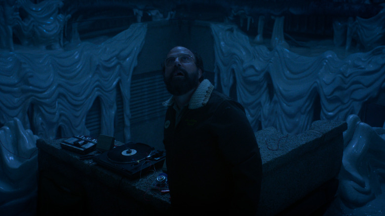 Brett Gelman's Murray Bauman looking up in a melted laboratory in Stranger Things