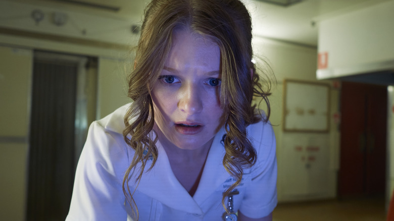 a nurse looks terrified
