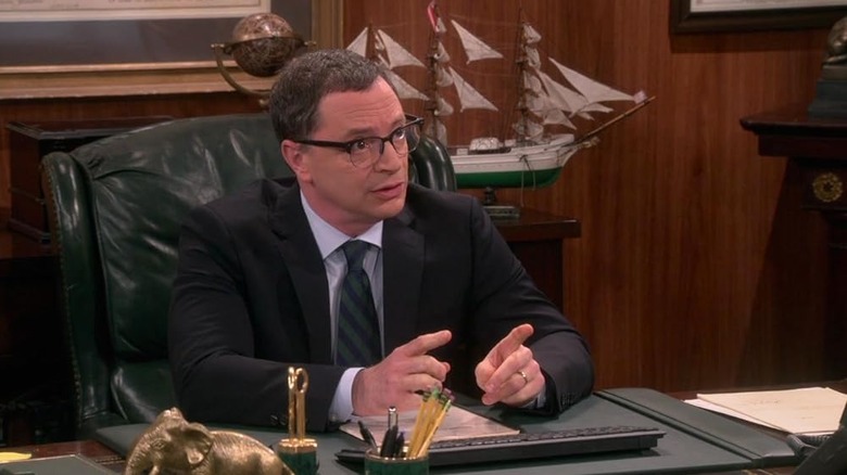 President Siebert (Joshua Malina) sitting at his desk talking on The Big Bang Theory