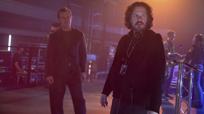 Director Edgar Wright standing in front of Josh Brolin as Dan Killian on the set of The Running Man
