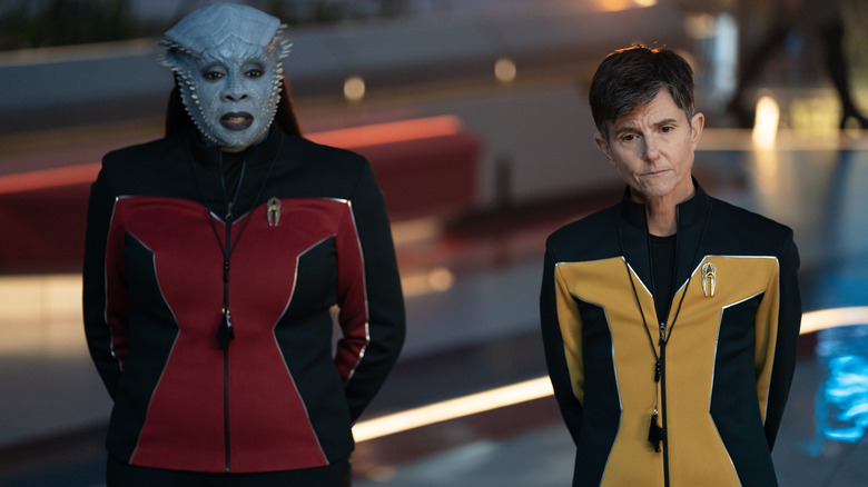 Gina Yashere as Lura Throk and Tig Notaro as Jett Reno standing side by side in Starfleet Academy