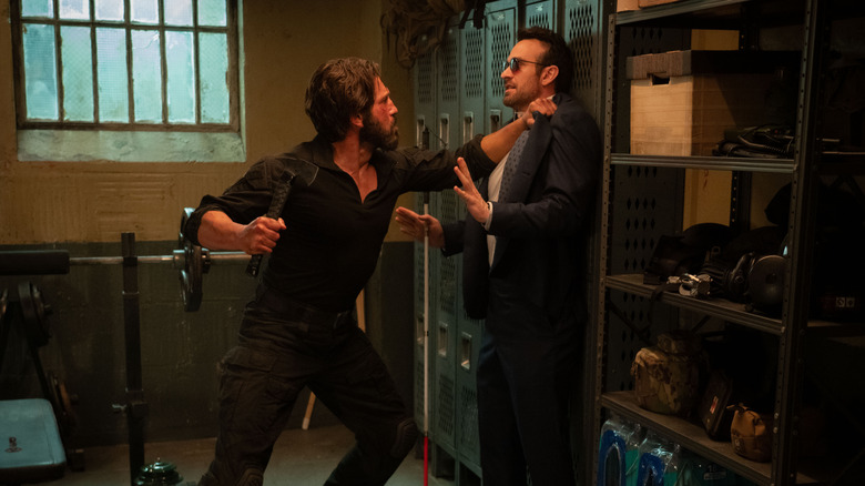 Jon Bernthal's Frank holding Charlie Cox's Matt up against lockers in Daredevil: Born Again