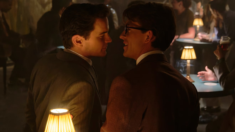 Hawk and Tim getting cozy in a club in Fellow Travelers