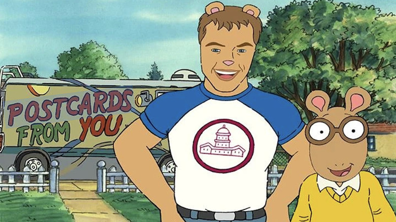 Arthur the aardvark, dressed in a yellow seater, smiles at the camera with Matt Damon, drawn to look like an aardvark with brown skin and a tight t-shirt, in front of a van that reads "Postcards From You" in "Arthur"