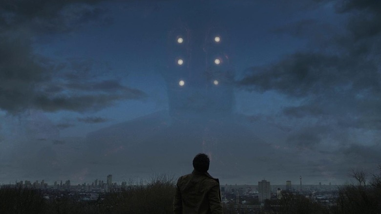 Kit Harrington as Dane staring up at Arishem in the sky at the end of Eternals