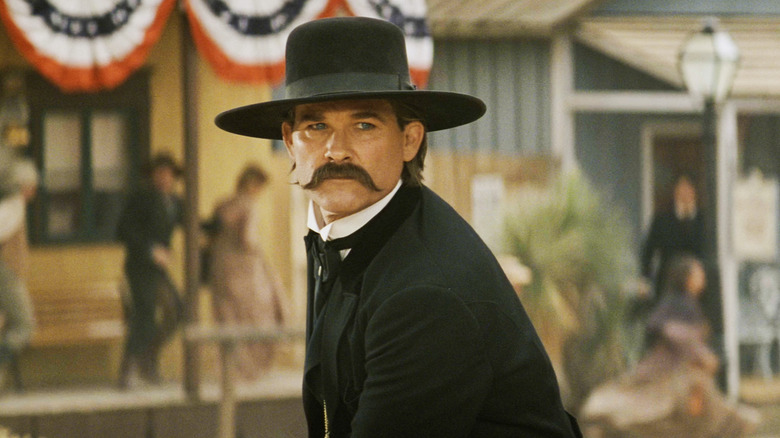 Kurt Russell's Wyatt Earp is seen standing in a street in Tombstone