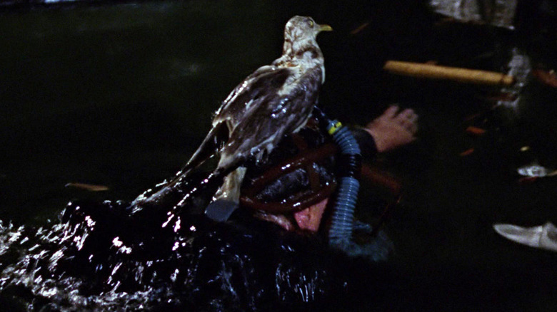 Sean Connery's James Bond emerges from water wearing a seagull snorkel