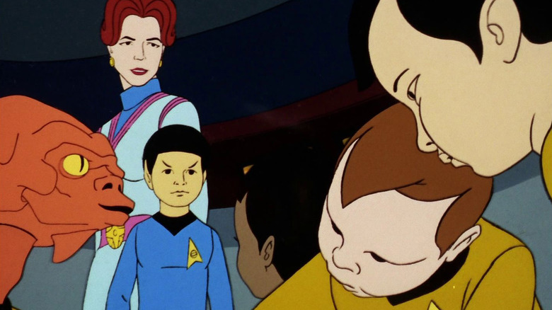 A woman looks at the Enterprise crew as babies on Star Trek: The Animated Series