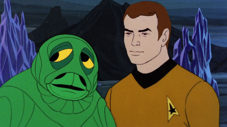 Kirk next to a small green alien on Star Trek: The Animated Series