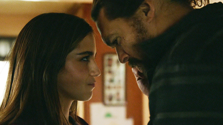 Isabela Merced's Rachel Cooper and Jason Momoa's Ray Cooper rest their heads together in Sweet Girl