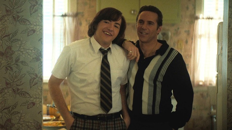 Michael Gandolfini as Tony Soprano and Alessandro Nivola as Dickie Moltisanti share a rare moment of warmth in The Many Saints of Newark