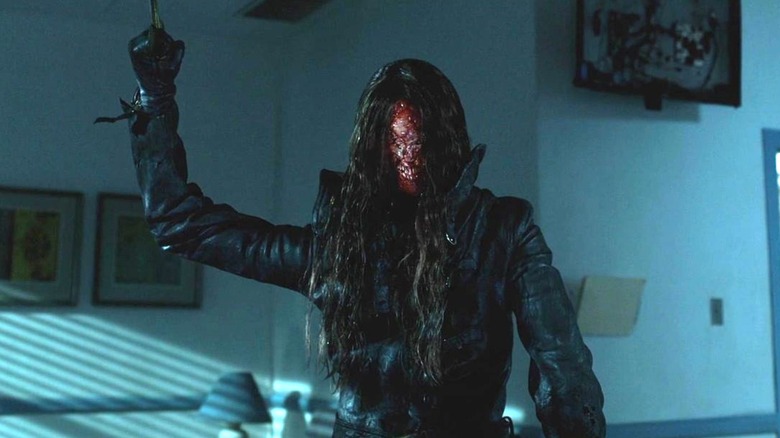 Gabriel holding up a knife in Malignant