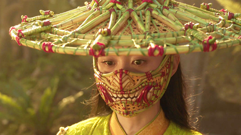 Fala Chen as Ying Li wearing a mask and hat in Shang-Chi and the Legend of the Ten Rings