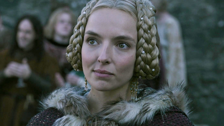 Jodie Comer as Marguerite de Carrouges wearing a fur-lined cloak in The Last Duel