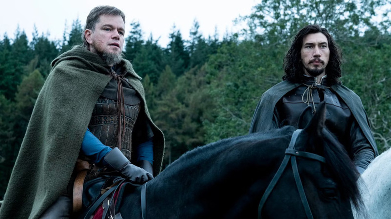 Matt Damon as Jean de Carrouges and Adam Driver as Jacques le Gris on horseback in The Last Duel
