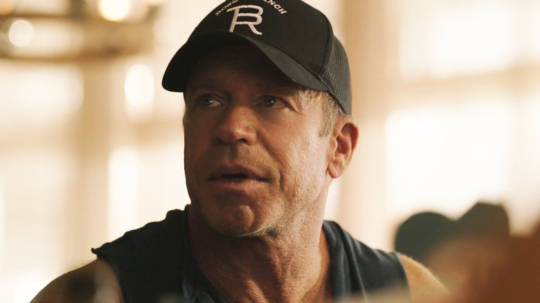 Taylor Sheridan's Travis Wheatley looks up as he sits at a poker game in Yellowstone