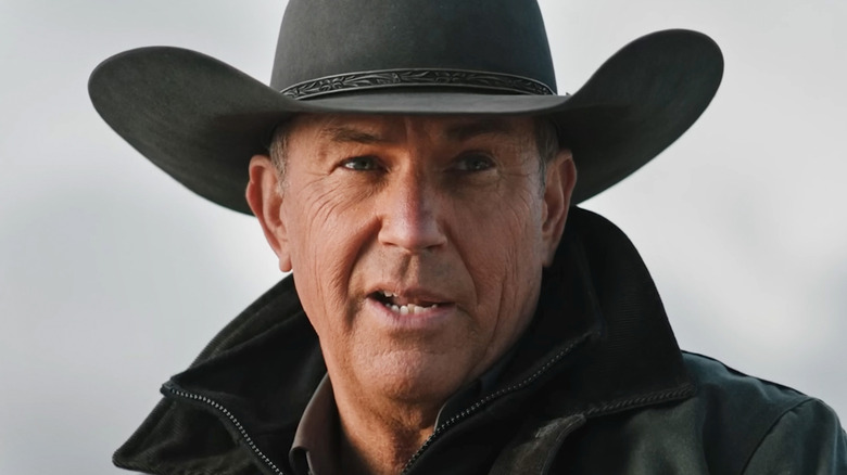 Kevin Costner's John Dutton is seen in closeup against a pale background in Yellowstone