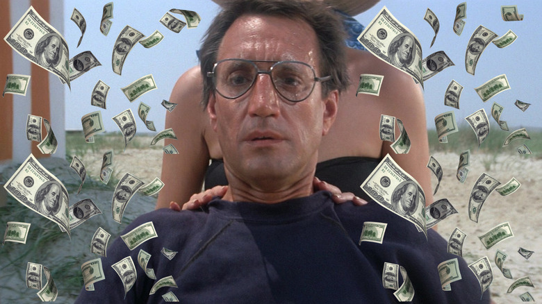 The zoom in on Roy Scheider as Brody on the beach surrounded by money in Jaws