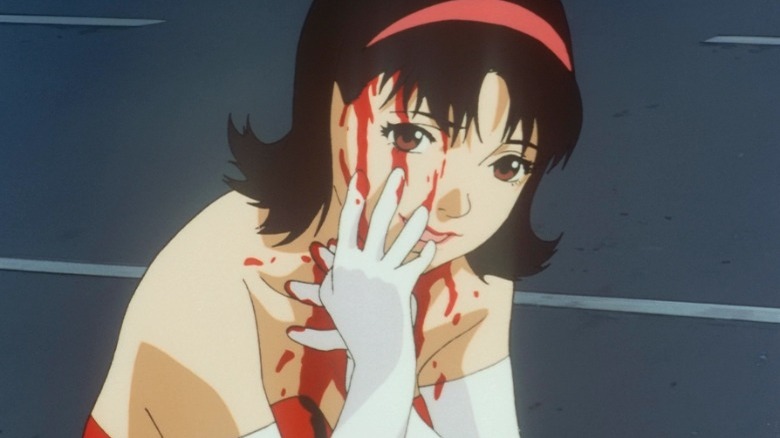 Mima streaks blood down her face