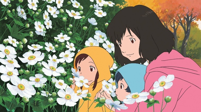 Hana shows her children flowers