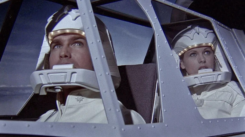 Troy (Kent McCord) and Jamie Hamilton (Robyn Douglass) stare out of a cockpit in Galactica 1980