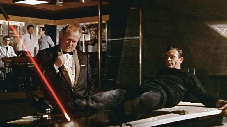Goldfinger torturing Bond in Goldfinger