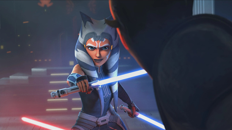Ahsoka smirking as she faces off against Maul in Star Wars: The Clone Wars