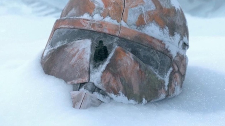 Darth Vader reflected in the visor of a frozen clone trooper helmet in Star Wars: The Clone Wars
