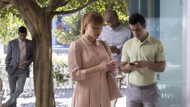 Several people on their cell phones in public
