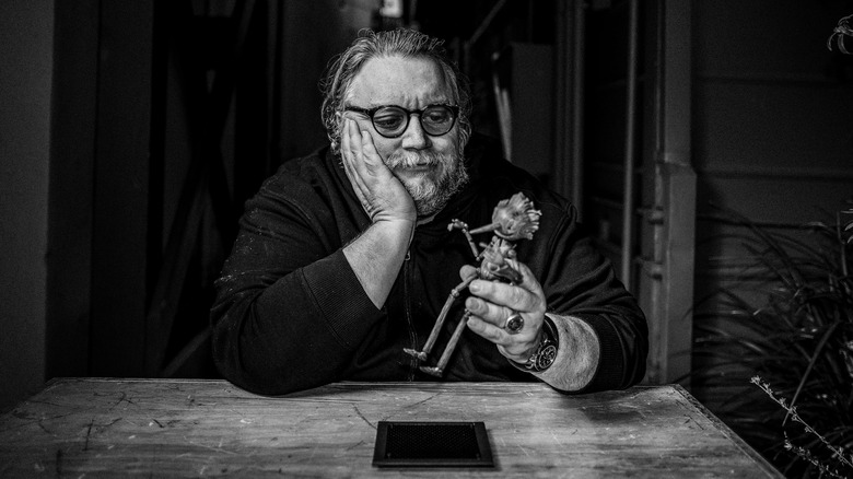 Guillermo del Toro holding Pinocchio