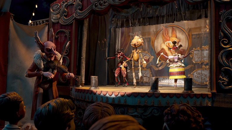 Pinocchio on stage near Count Volpe