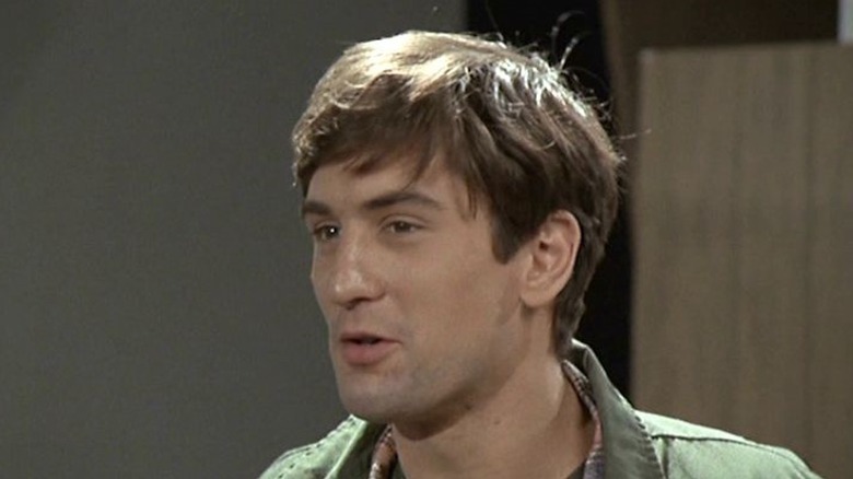 Robert De Niro smirks as Jon Ruben in Hi, Mom