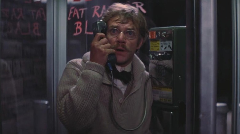 H.G. Wells talking on a payphone in Time After Time