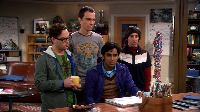 Leonard Sheldon Howard and Raj all looking confused in the living room on The Big Bang Theory