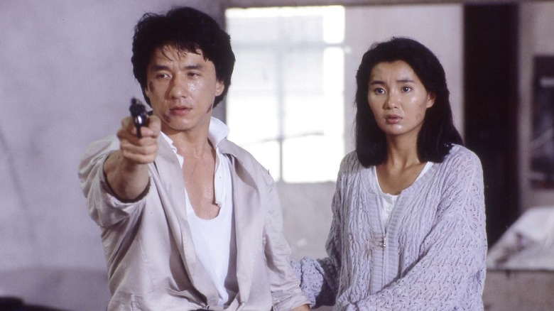 Jackie Chan pulls a gun