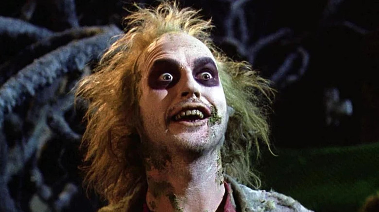 Betelgeuse (Michael Keaton) excitedly looks up in Beetlejuice