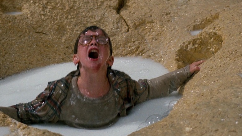 Nick Szalinski (Robert Oliveri) swims up to an enlarged piece of cereal in a bowl of milk in Honey, I Shrunk the Kids