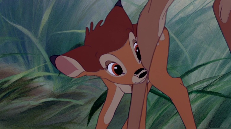Hardie Albright as Bambi staring shyly from behind his mother's legs in Bambi