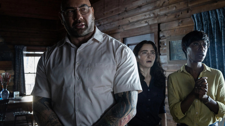 Dave Bautista, Nikki Amuka-Bird, and Abby Quinn in Knock at the Cabin