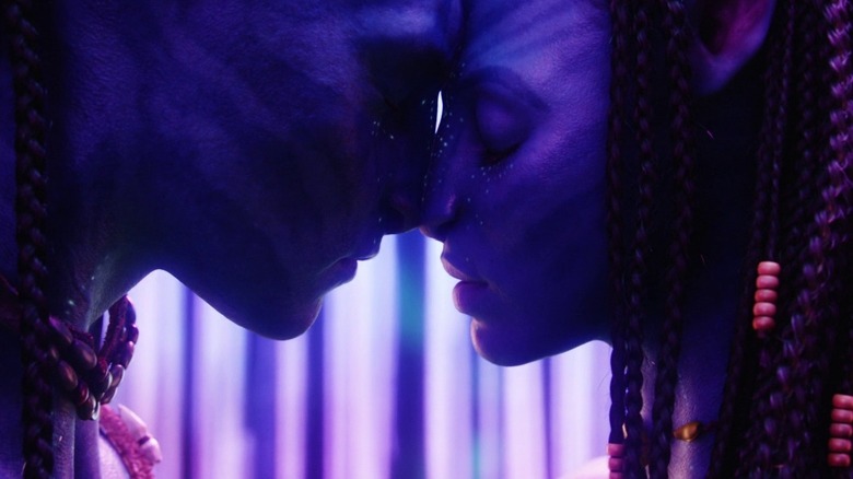 Jake (Sam Worthington) nuzzles Neytiri (Zoe Saldana) in Avatar