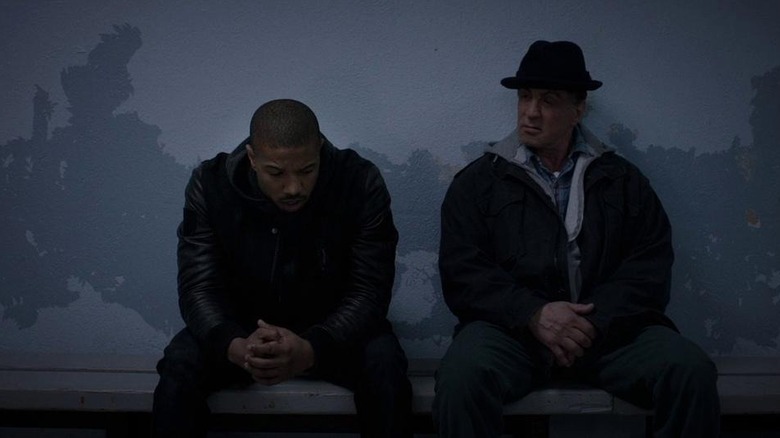 Donny (Michael B. Jordan) talks to Rocky (Sylvester Stallone) in Creed