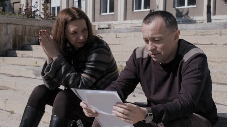journalists reviewing documents in Collective